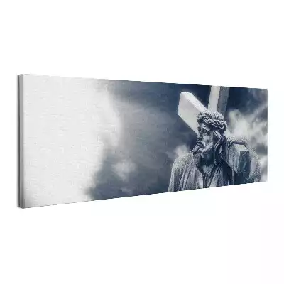 Obraz canvas Kamienna rzeźba Jezusa z krzyżem i niebo