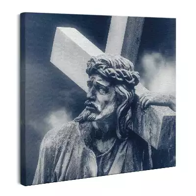Obraz na płótnie Kamienna rzeźba Jezusa z krzyżem i niebo